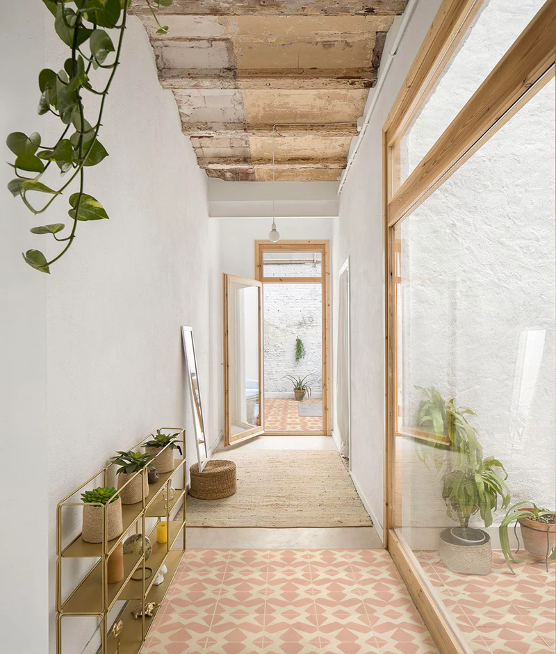 Outdoor aisle with pink and white tiles