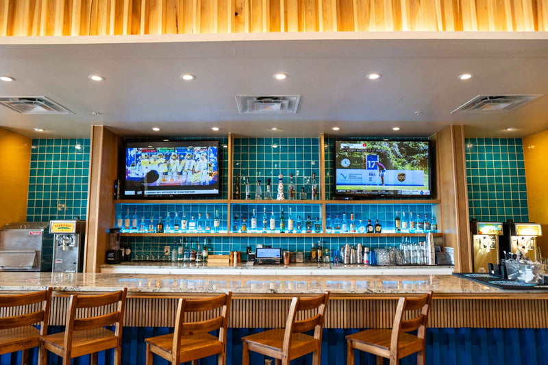 Turquoise crackled tiles in backsplash and bar