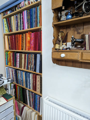 showing fabric stored upright like books