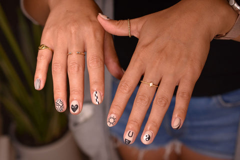 A set of black and white matte graphic nail art done at Hello Birdie Nail and Lash Lab