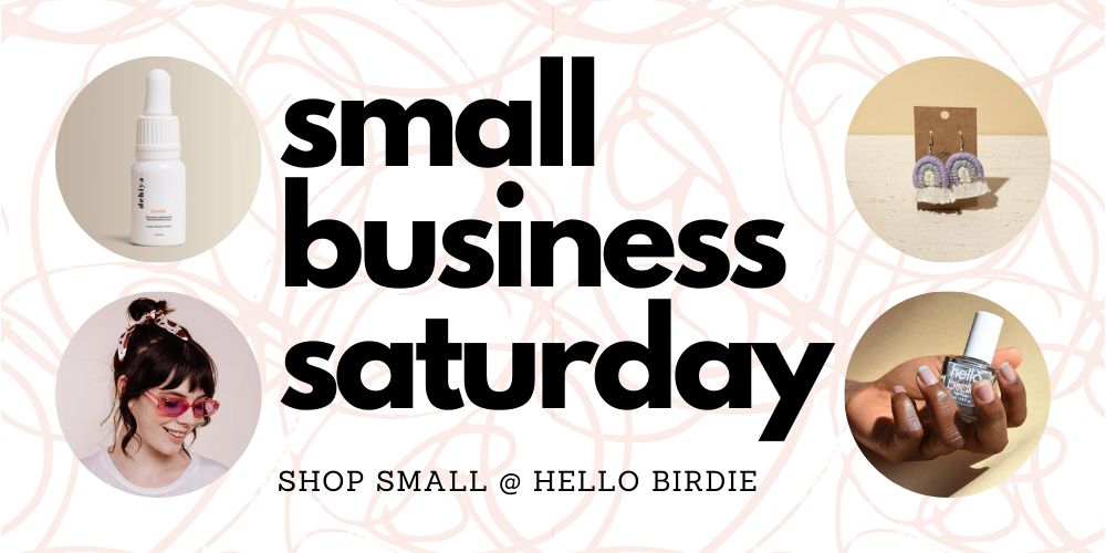 large bold text reading "small business saturday: shop small at hello birdie" on a pale pink doodle background, with four round images of product in each corner, clockwise from top left: dehiya serum, rustico earrings, i'm with the band scrunchie, hello birdie polish