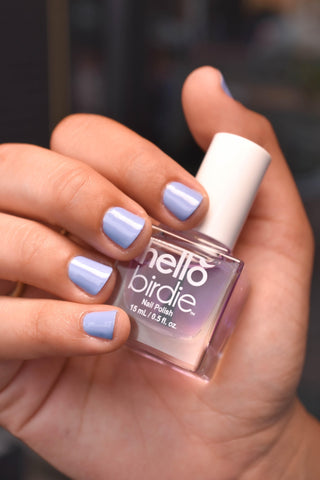 Hello Birdie glossy top coat on top of lavender polish