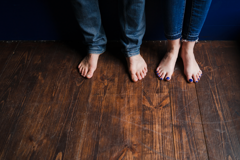feet on wooden floor