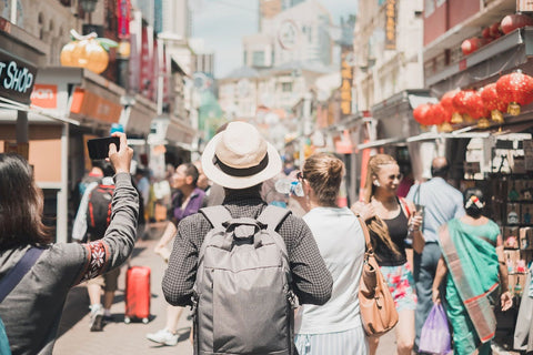 man walking on busy street