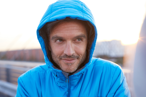 man in hoodie jacket in the rain