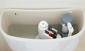 open toilet tank filled with water