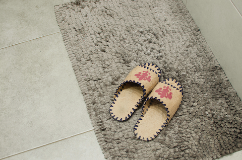 floor mat concealed safe with slippers ontop