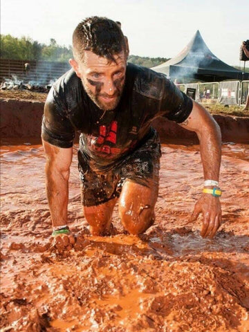 Kevin "Mudman" LaPlatney powers through a mess of churned mud in his finest (and now messiest) MudGear apparel.