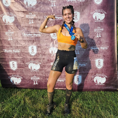 MudGear Athlete Taylor Hall flexes after a grueling Goliath At The Gorge race.