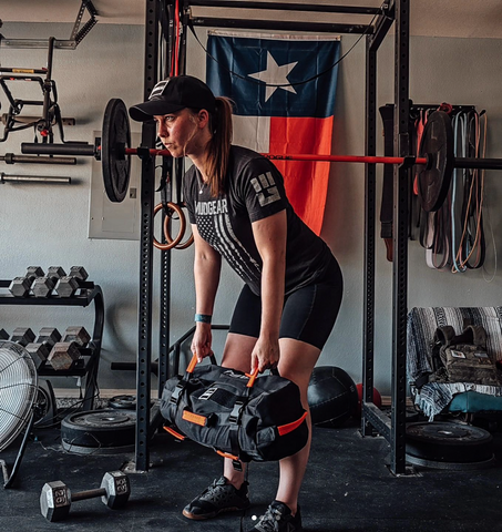 cortney rhode, female athlete, sandbag lifting