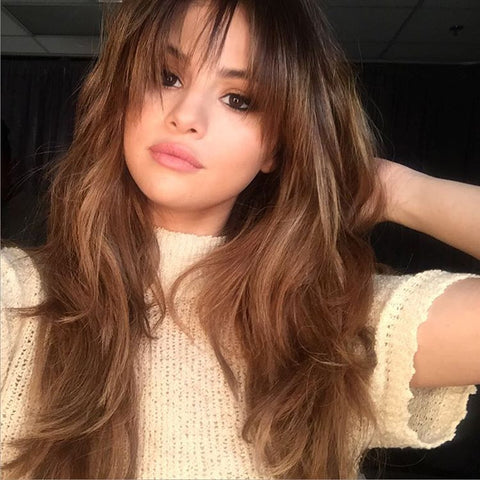 brunette woman with long hair and bangs