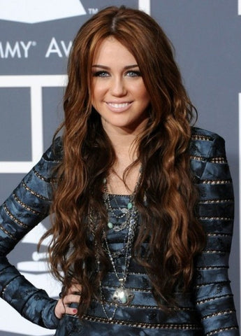 Miley Cyrus with long brown wavy hair