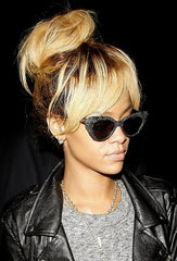 Dirty blonde Rihanna with high bun updo