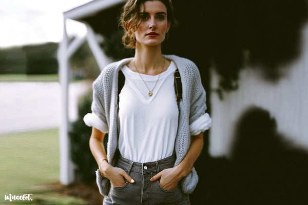 Solid white t shirt styled with a chunky cardigan sweater 