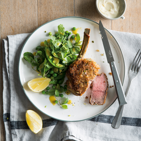 Crumbed veal cutlets with pea salad