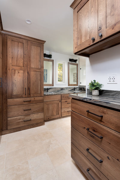 Remodeled Master Bathroom by Jackie Lopey of Wide Canvas with Custom Wirebrushed Knotty Alder Cabinets, Closet Removed and Replaced with Built-In Wardrobe Cabinets, Black Plumbing Fixtures