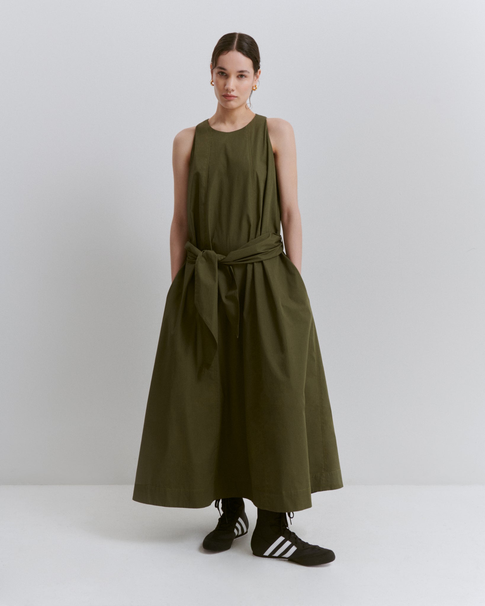 model wears Issue Twelve green cotton a-line dress