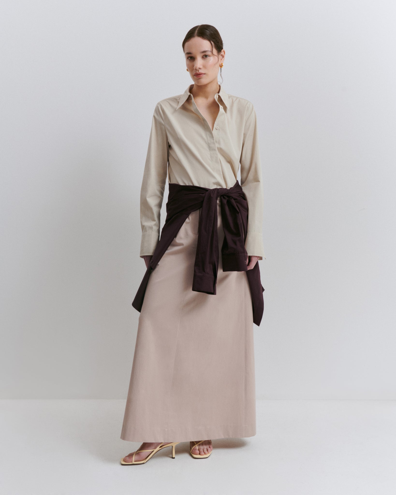 model wears Issue Twelve blush and stone cotton shirt and maxi skirt