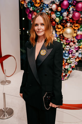 Stella McCartney wears Andrew Logan's iconic Smiley Brooch at the launch of her STELLABRATION Pop Up at Selfridges Corner Shop