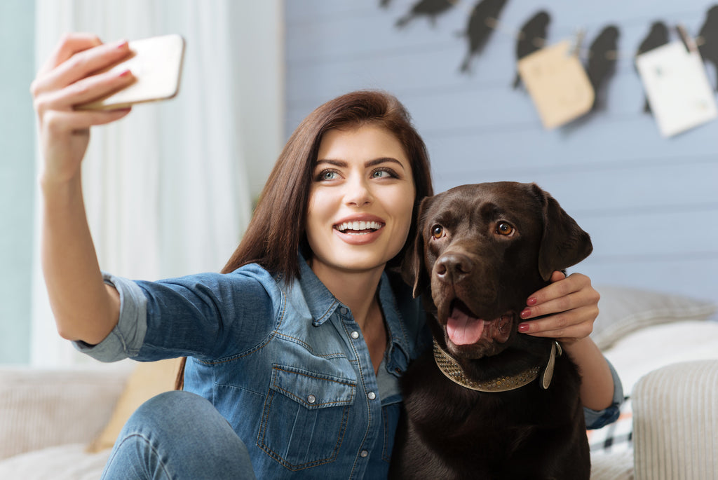 Lady Taking Photo With Her Dog