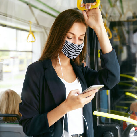 woman in zebra mask on train