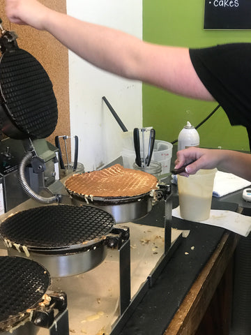 waffle cones being made on an iron