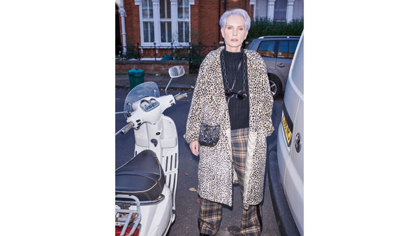 model-wears-wide-leg-trousers-a-black-knitted-top-and-a-leopard-print-coat
