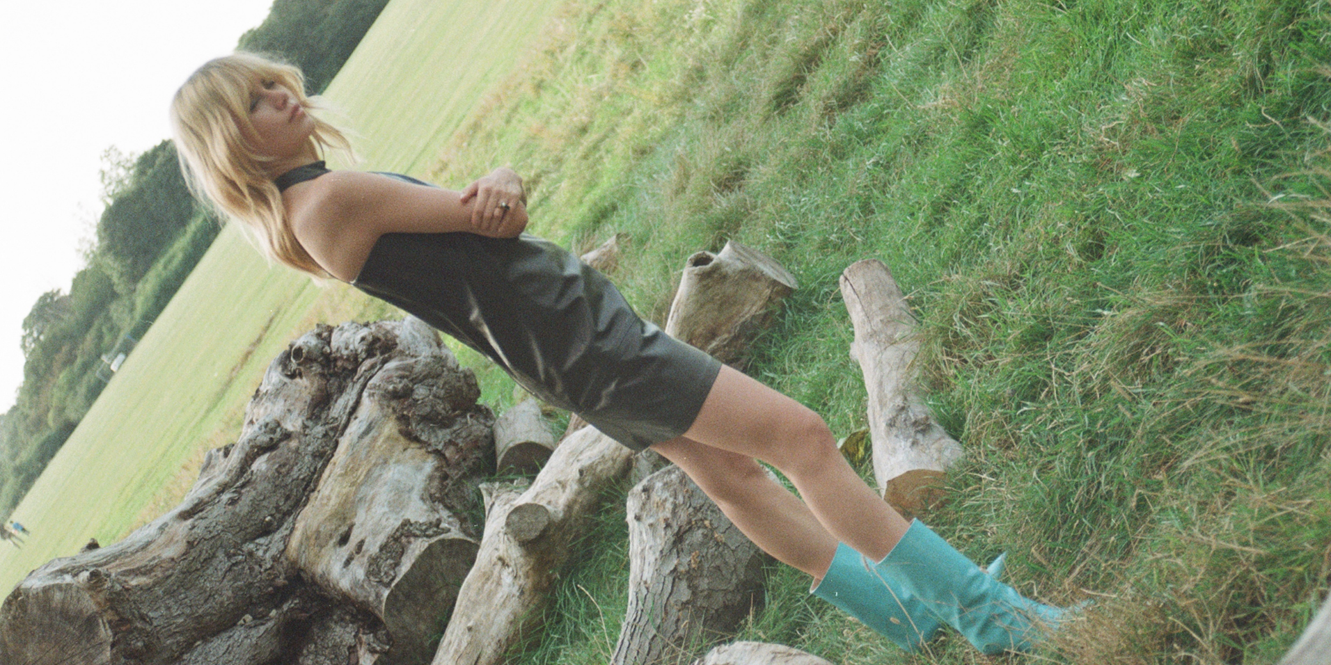 little black leather dress blue boots nature field blond model skiim sustainable womenswear