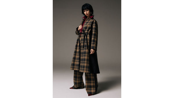 model-wears-SKIIM-brown-check-coat-and-wide-leg-check-trousers