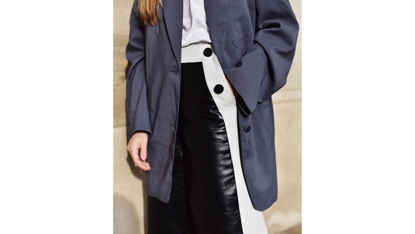 close-up-of-model-wearing-blue-oversized-blazer-black-and-white-leather-pencil-skirt-and-white-t-shirt