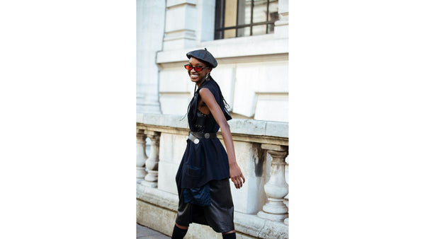 model-wears-black-midi-leather-dress-with-belt-with-black-leather-beret