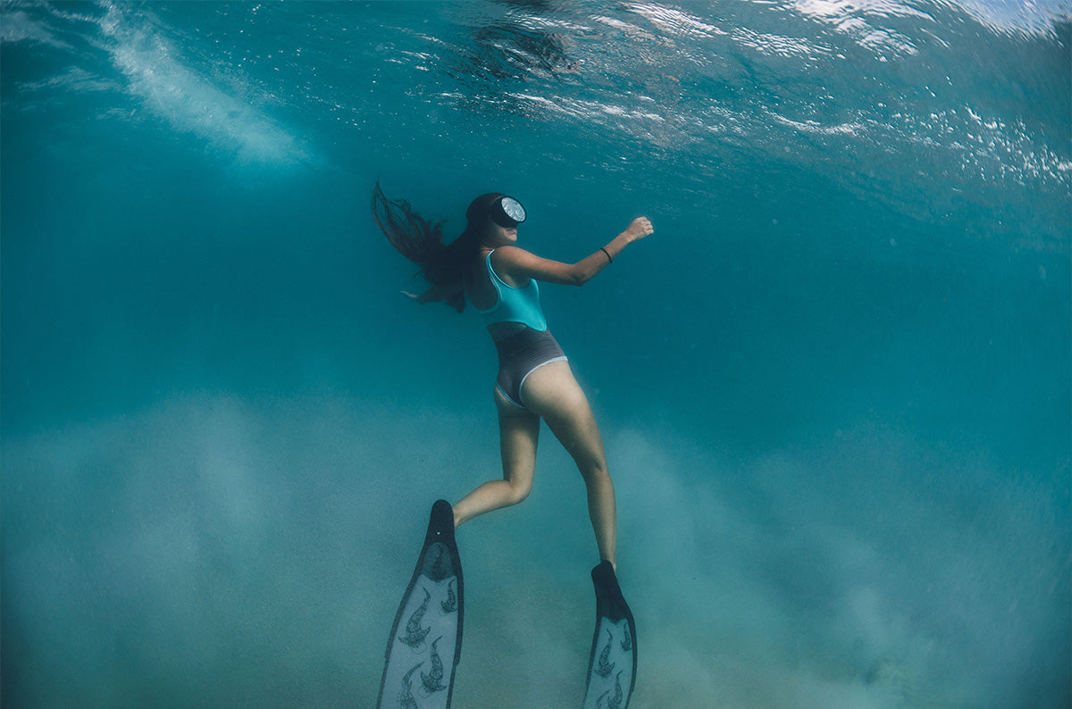 Madison Stewart wearing our Deep Roots One piece 
