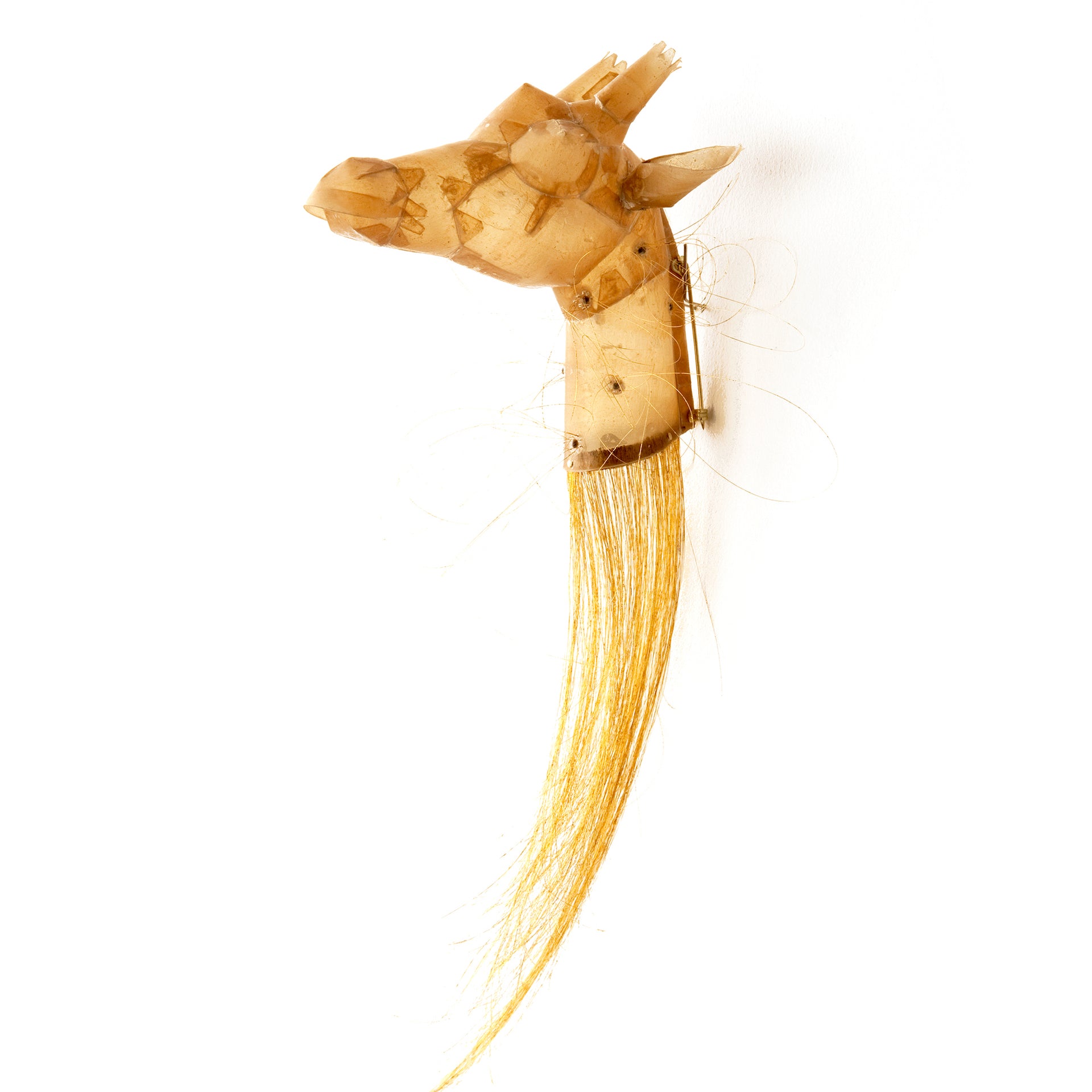 Represented by Ornamentum: Giraffe by Eunmi Chun for Ornamentum, 2011, a brooch composed of human hair, gold leaf, cow gut, seeds, and silver. Acquired by the Rhode Island School of Design Museum. Photo courtesy of Ornamentum and the artist
