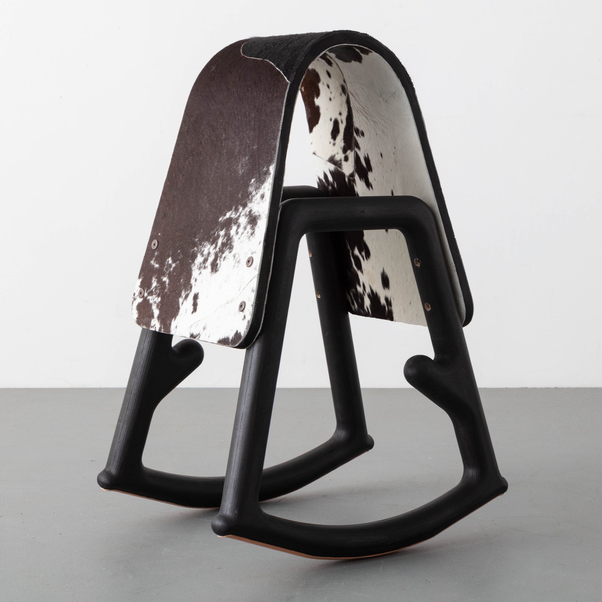 Represented by R & Company: Sinmi Stool by Norman Teague, 2020, made of ebonized birch and birch plywood with leather saddle by Yohance Lacour. Acquired by the Smithsonian National Museum of African American History and Culture. Photo © Joe Kramm; courtesy of R & Company and the artist
