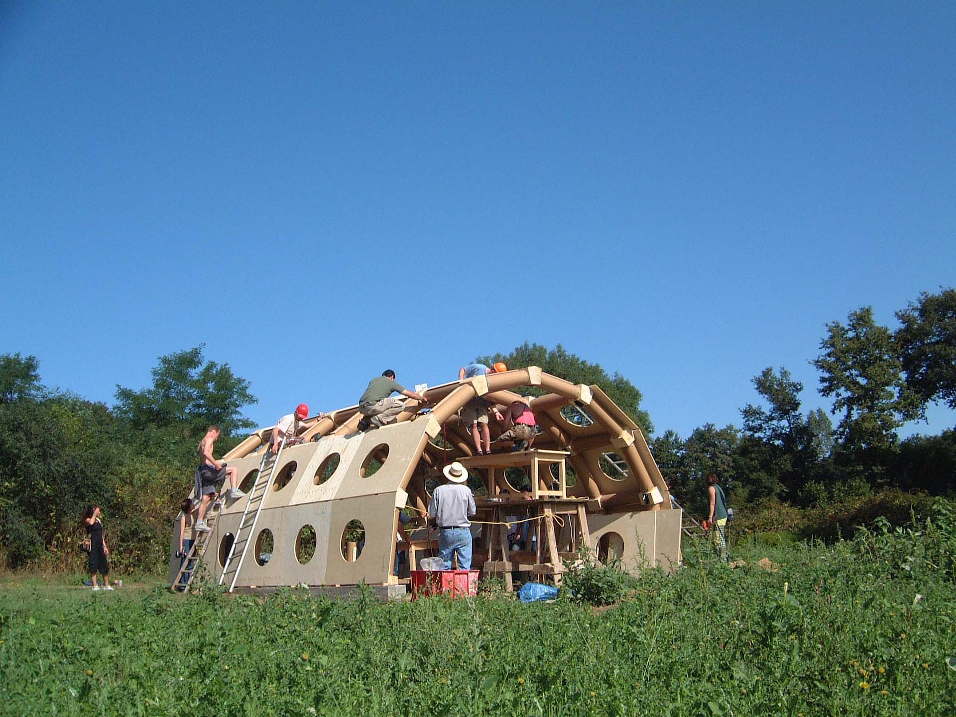 Students help construct the Paper Pavilion by Shigeru Ban during a summer workshop. Photo © Domaine de Boisbuchet