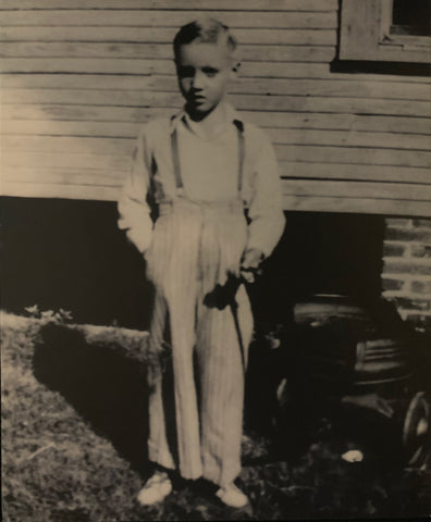 Elvis Presley standing outside his family home