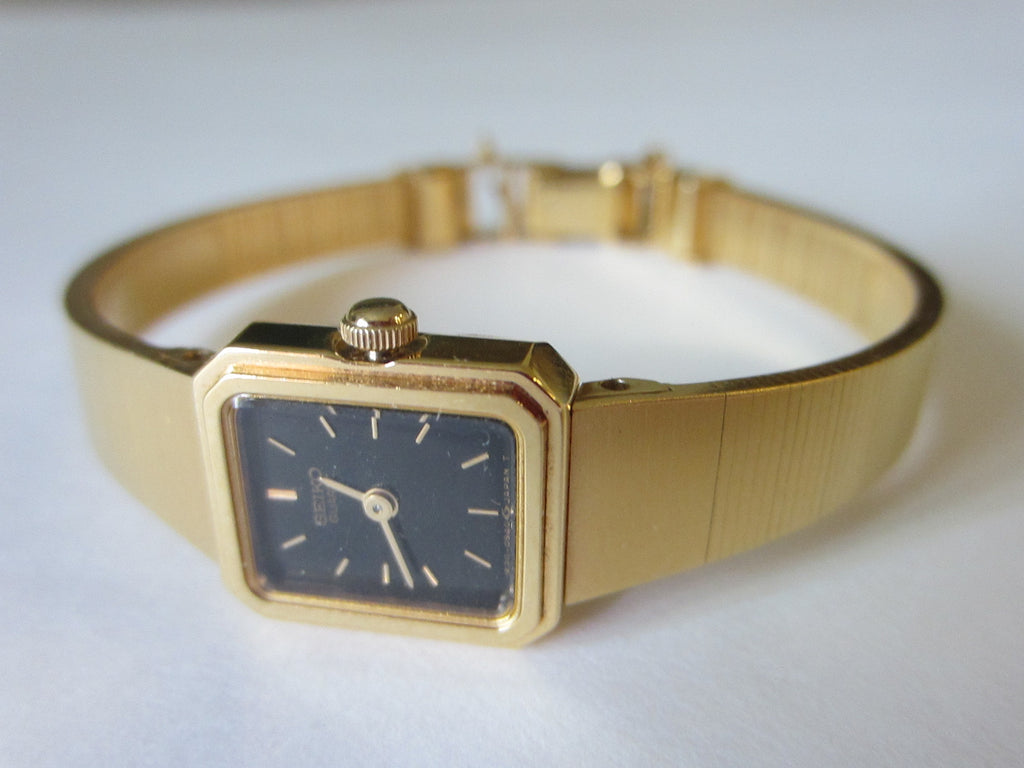 seiko gold watch black face