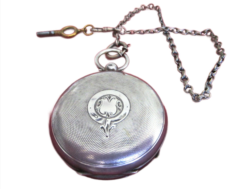 antique silver pocket watch and chain