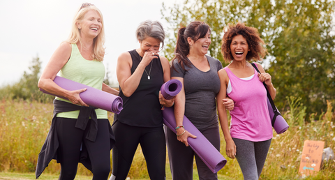 woman feeling good chatting and smiling after a workout class