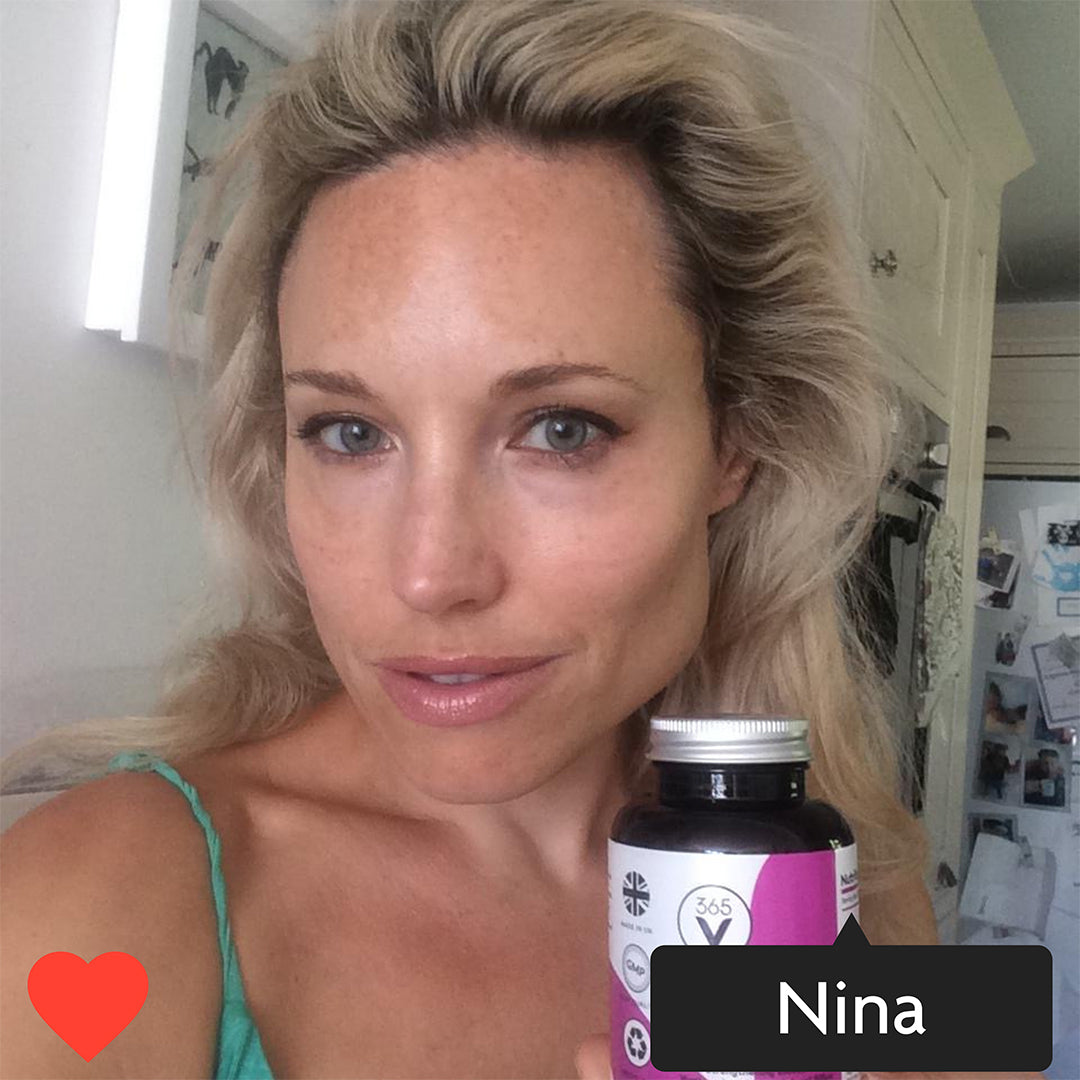 Instagram style image with Nina tagged in. Nina is holding a pot of Vitamini Advanced Collagen Supplements. Nina is smiling and has glowing skin.