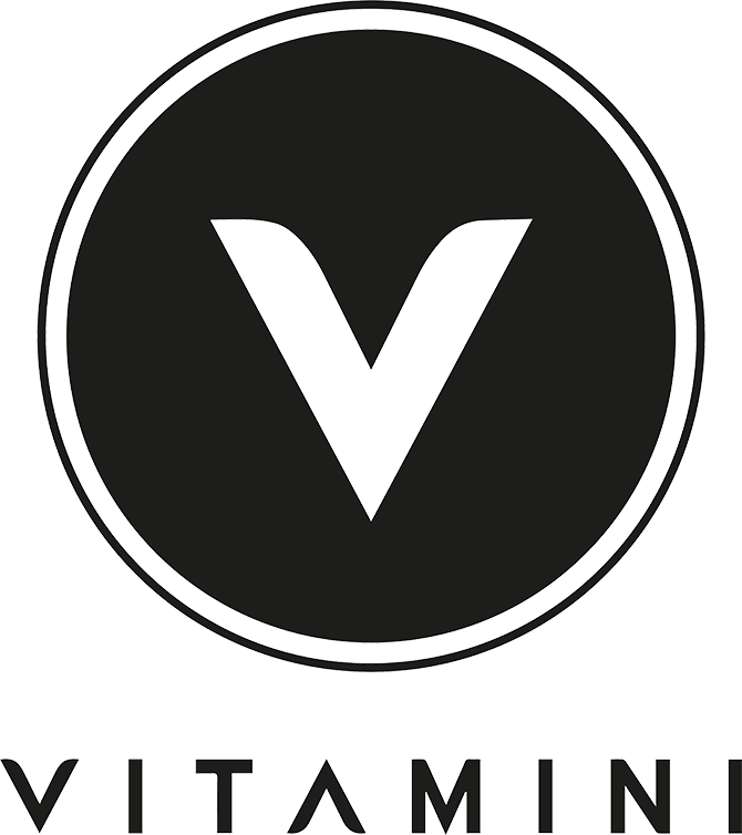 Vitamini Logo, a white V in a black circle with VITAMINI underneath the circle.