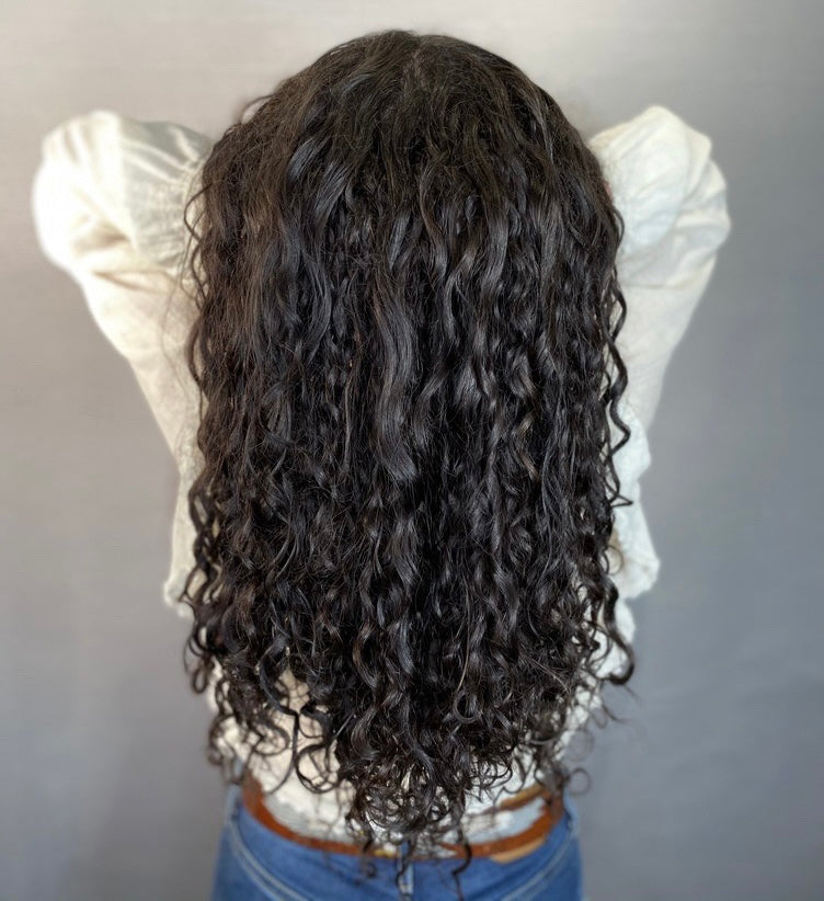 Woman with curly hair extensions