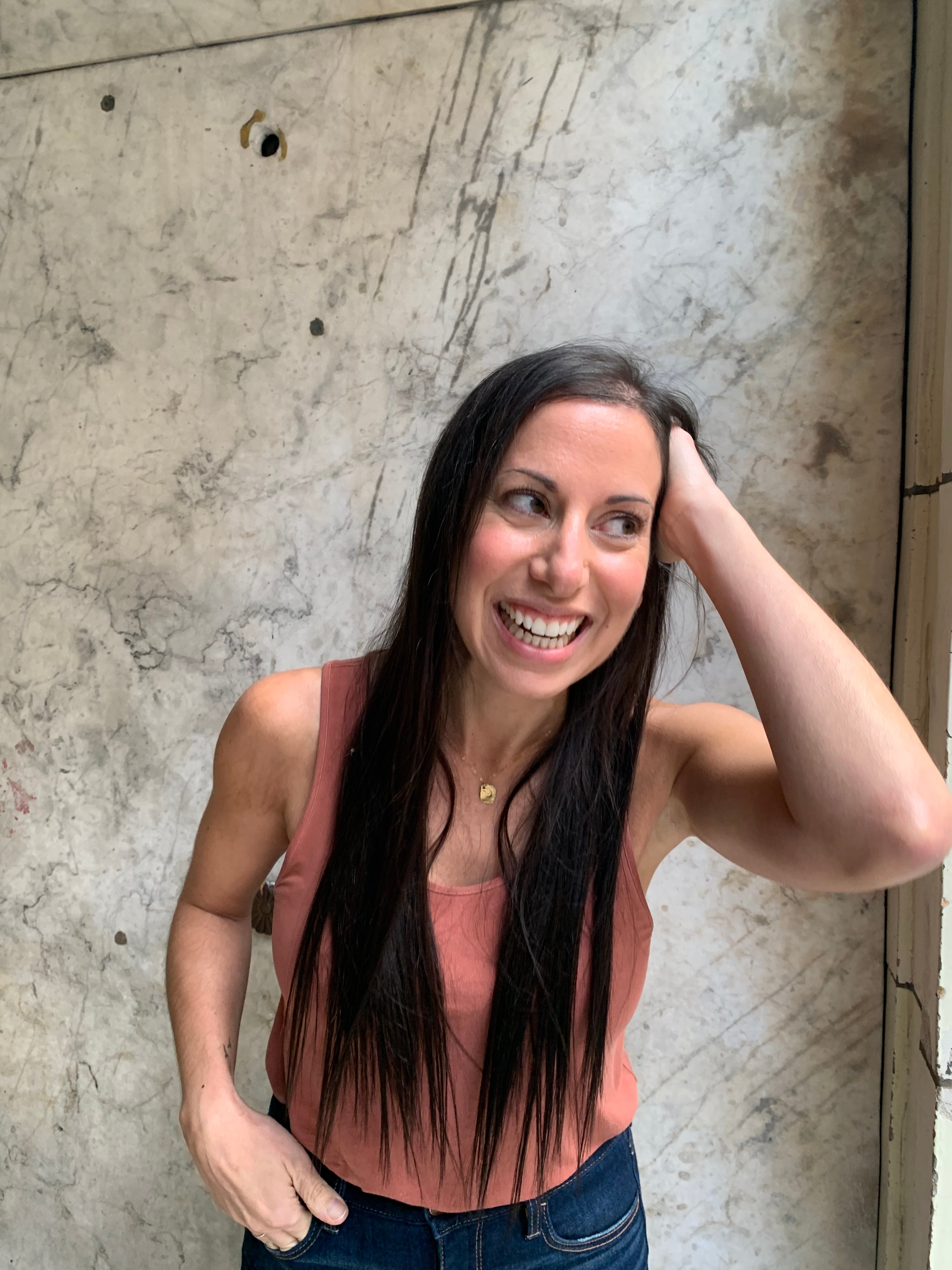 woman smiling with new hair extensions