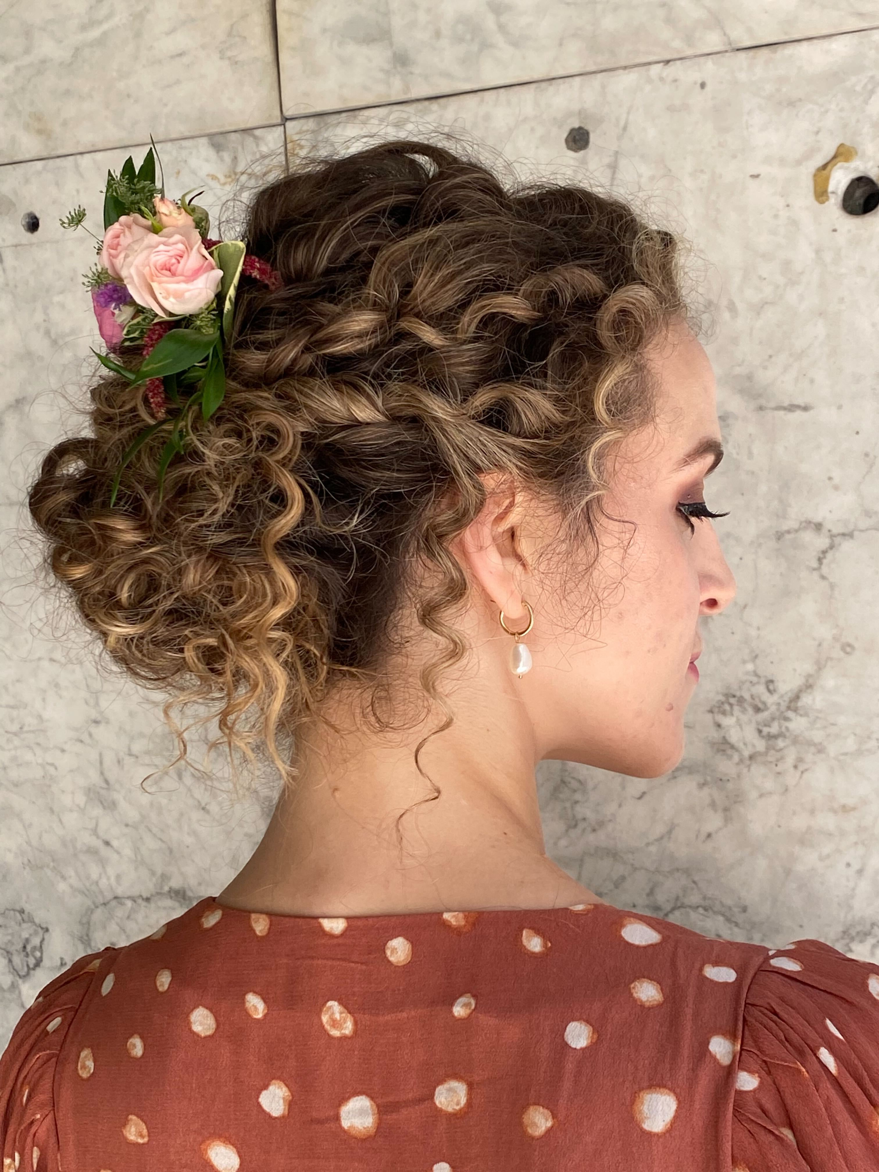 A bride shows off her hair.