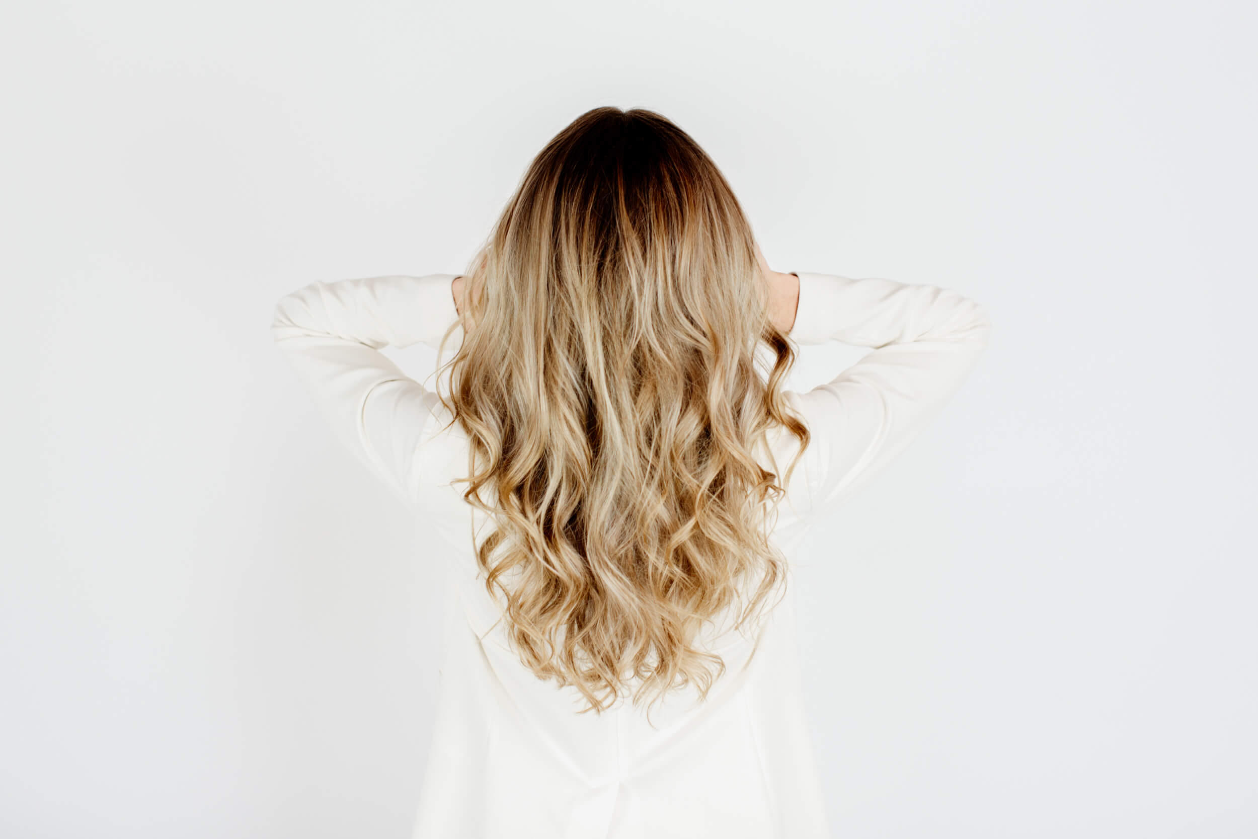 Blonde hair as shown from the back.