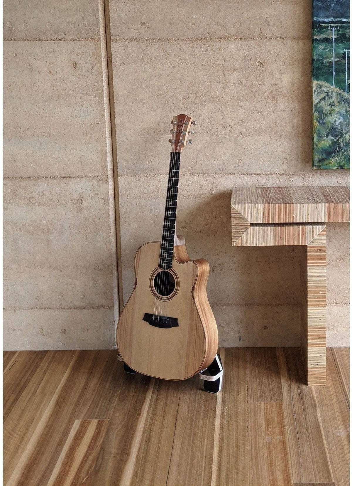 acoustic guitar on stand