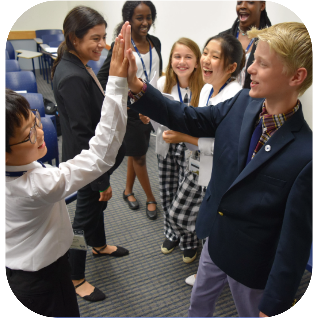 MUN Institute Summer campers high fiveing