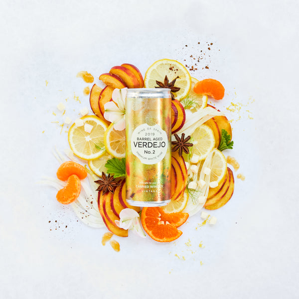 Canned Wine Co. Verdejo surrounded by stone and citrus fruit representing its flavour profile