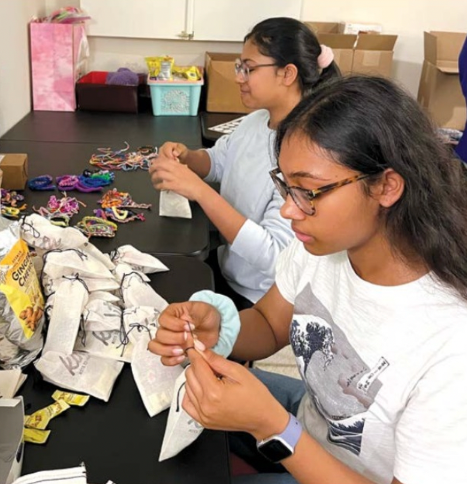 Sanjana and Anjali Jain volunteering for Kits to Heart