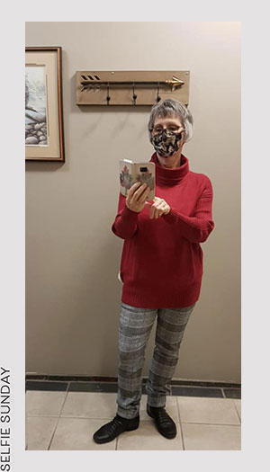 Teresa from Patryka Designs is wearing a Renuar sweater and Tribal pants.